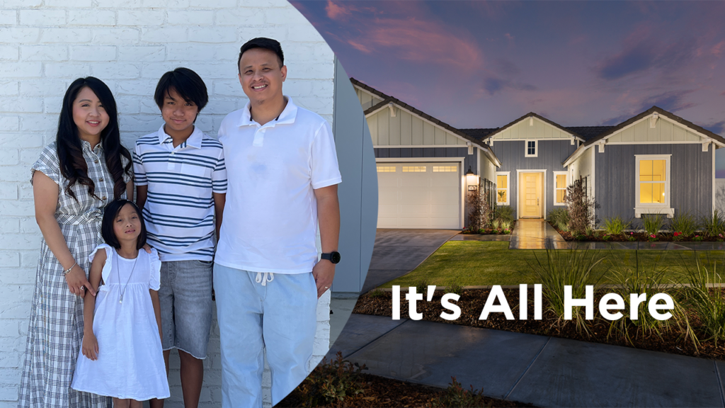 A happy family of four, with two adults and two children, stands smiling in front of a modern suburban home during twilight. text overlay reads "it's all here.