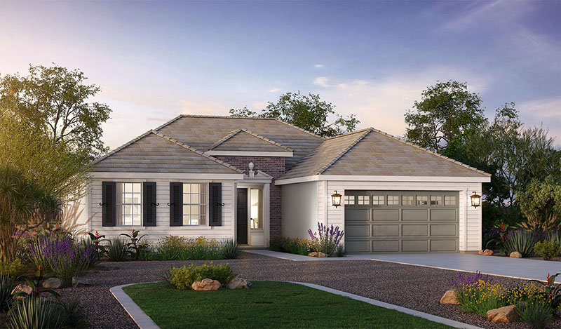 A modern single-story house with a gray shingled roof and beige exterior walls, featuring a two-car garage and landscaped garden with various desert plants under a dusk sky.