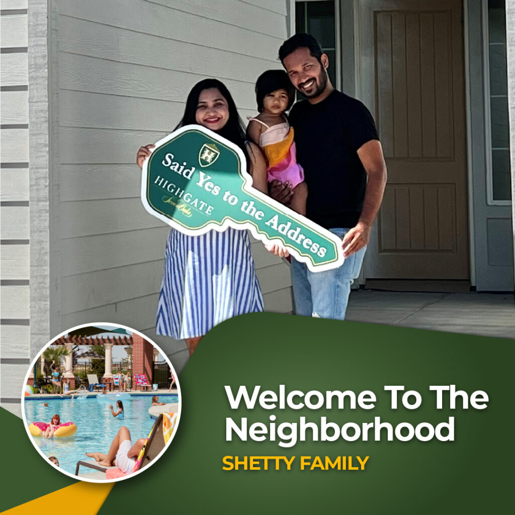 A smiling family of three stands in front of a new home. The parents hold a large key-shaped sign that reads, "Said Yes to the Address" while the child stands between them. The text at the bottom reads, "Welcome To The Neighborhood - Shetty Family.